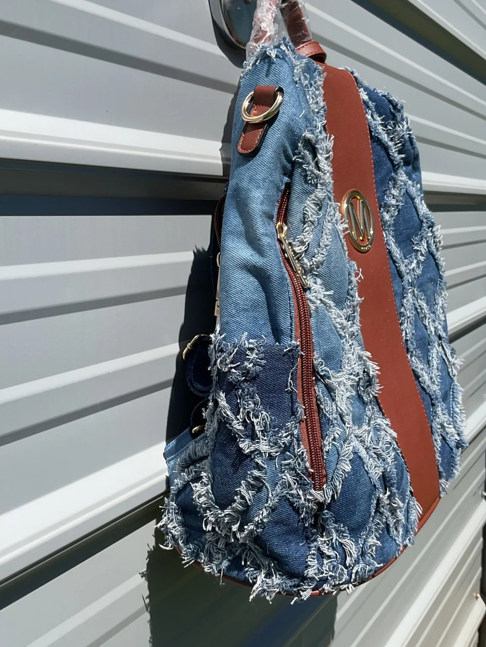 Denim Fringe Quilted Backpack with Brown Trim